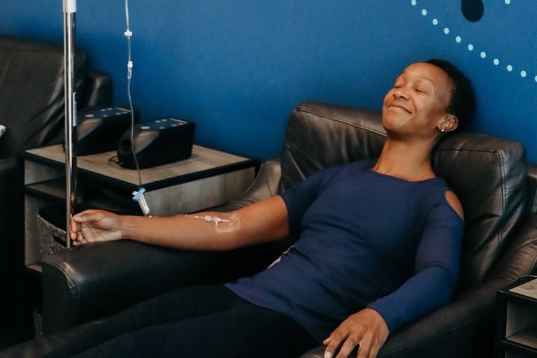 Woman enjoying Hydrafacial therapy at Restore Hyper Wellness