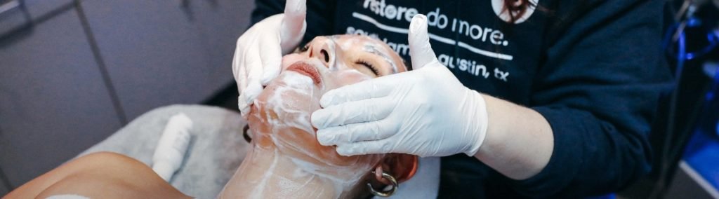 Woman enjoying Hydrafacial Oxygen Treatment at Restore