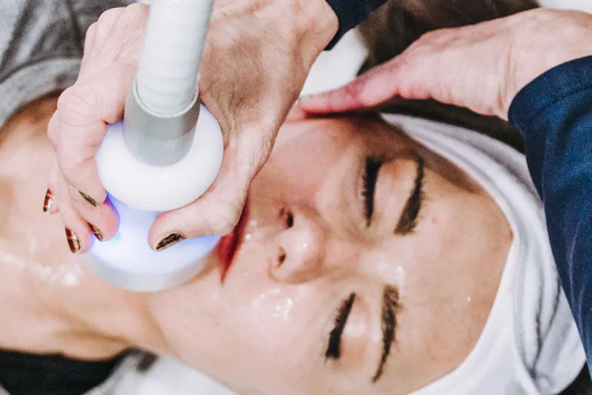 A woman receiving CryoFacial treatment at Restore North Mt Pleasant