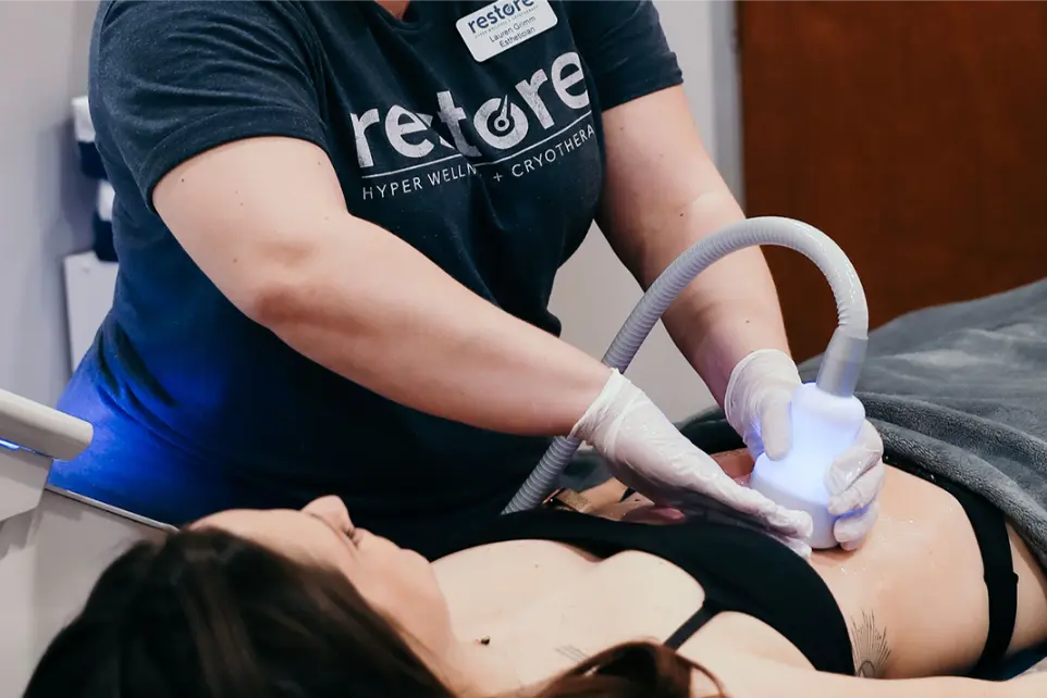 a woman with black hair during a cool sculpting procedure.