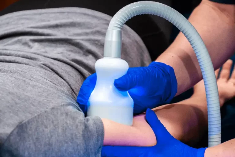 Lady Wellness Practitioner Preforms CryoToning and CryoSlimming With Gloves on Arm