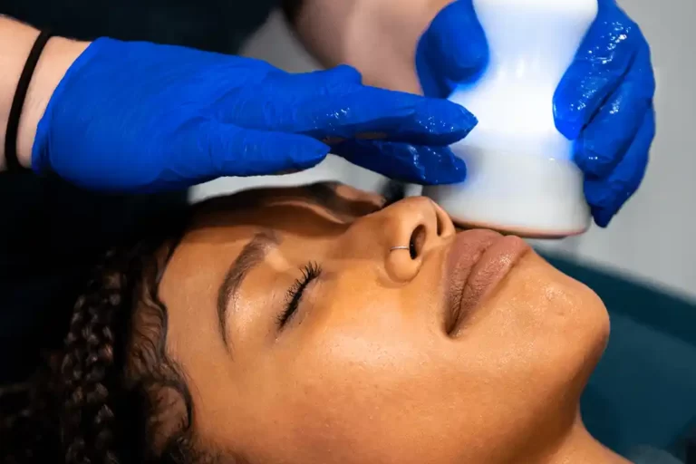 a woman during a cryoskin facial.