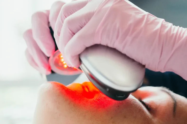 a close up of a woman getting a treatment.