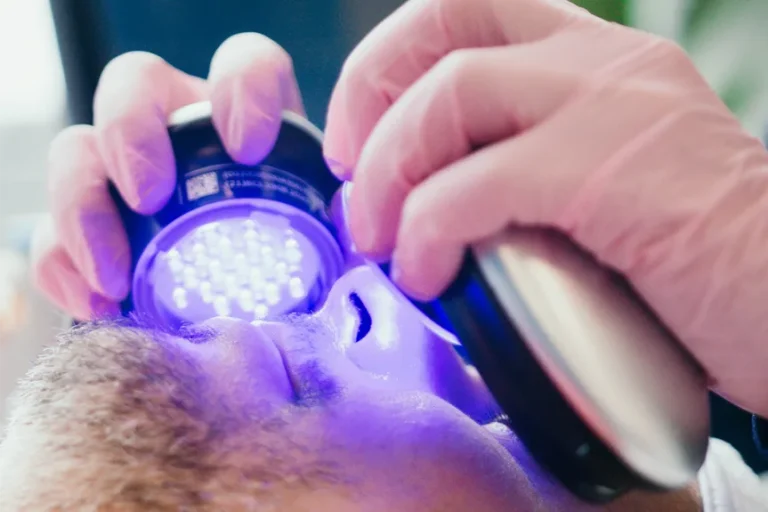 a bearded man getting a hydra facial.