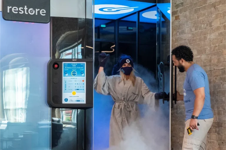 a woman with a hat leaving a cryochamber.